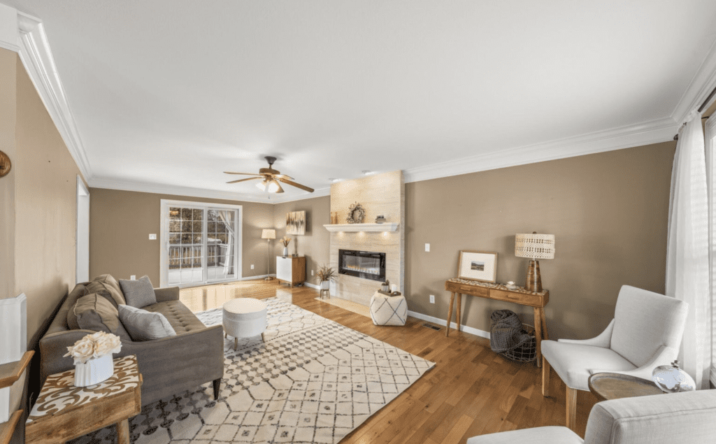 Cozy living room with fireplace and modern decor.
