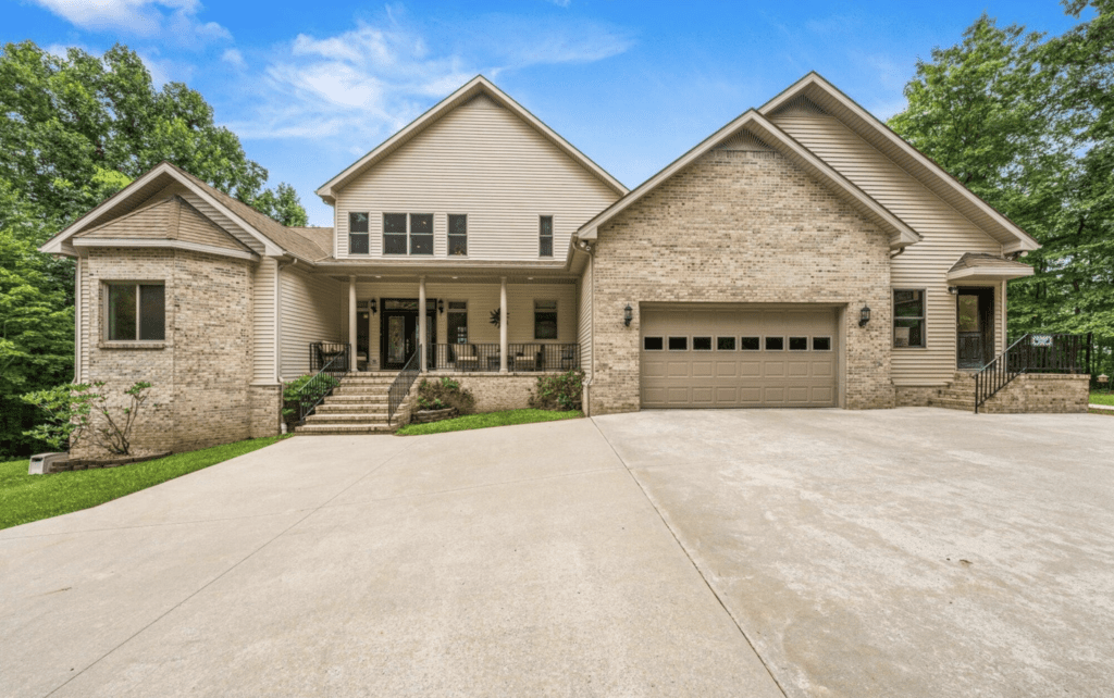 Spacious modern suburban house with a large driveway and attached garage.