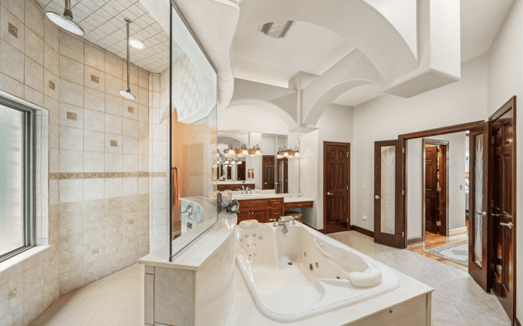 Luxurious bathroom with a large bathtub and elegant design.