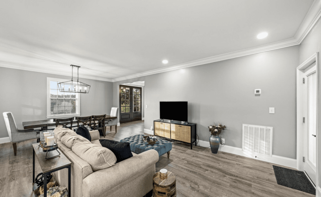 Modern living room with cozy seating and elegant decor.
