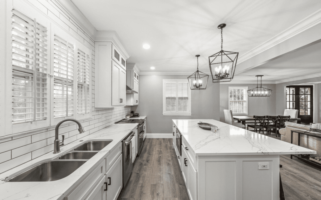Bright modern kitchen with white cabinets and island.