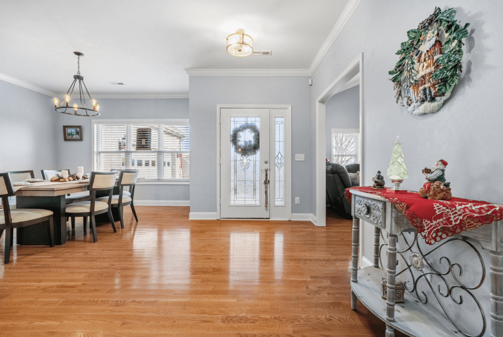 Bright living area with polished hardwood floors and modern decor.