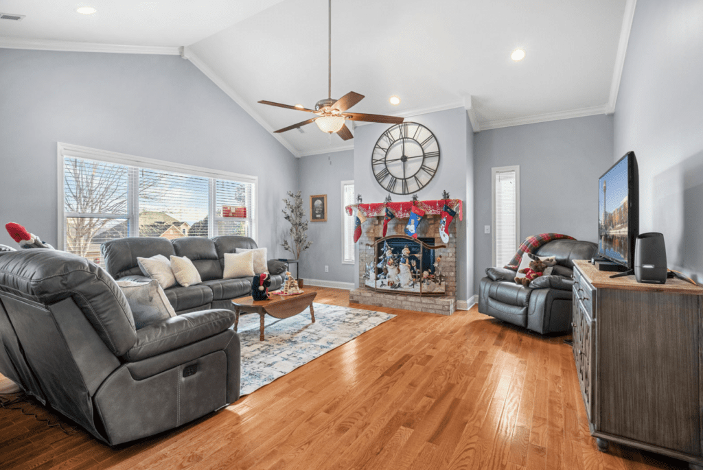 Cozy living room with a fireplace and holiday decorations.