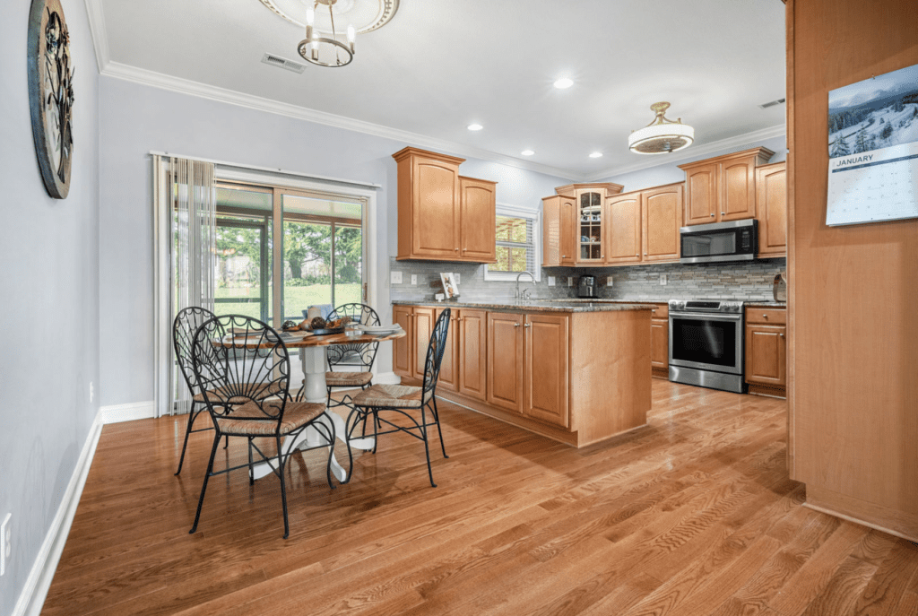 Spacious kitchen with wooden cabinets and breakfast nook.