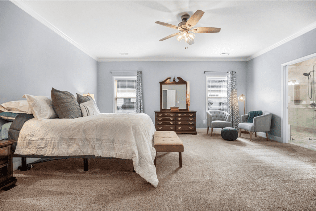 Cozy bedroom with neutral tones and elegant furniture.