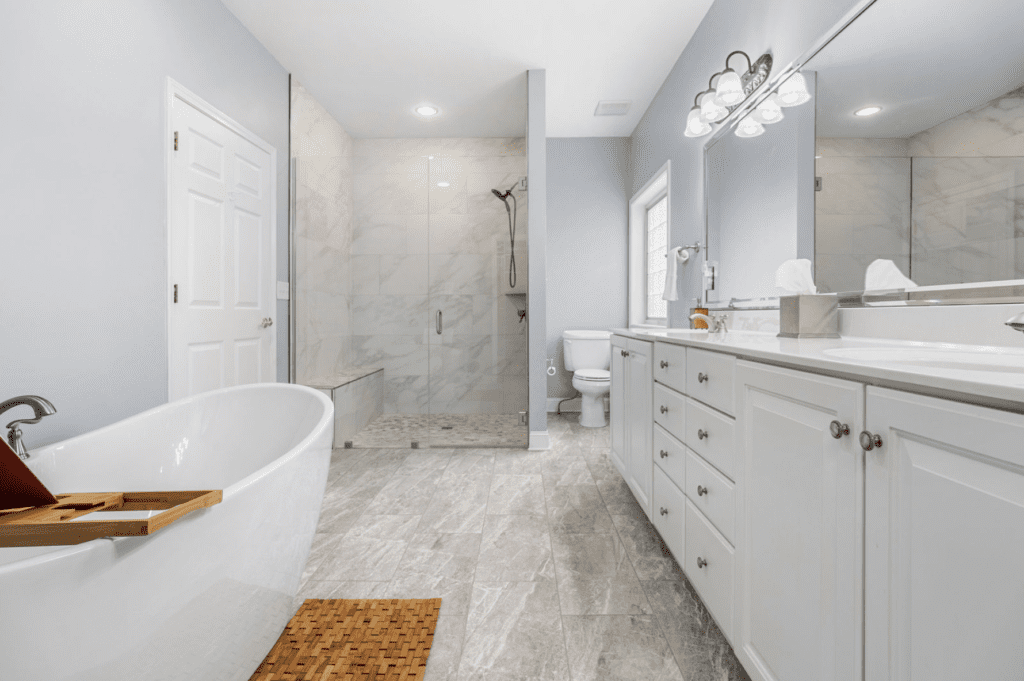 Spacious modern bathroom with a freestanding tub and walk-in shower.