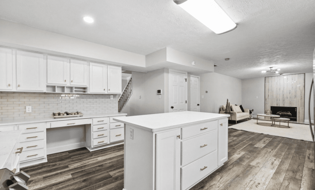 Bright modern kitchen with white cabinets and island.